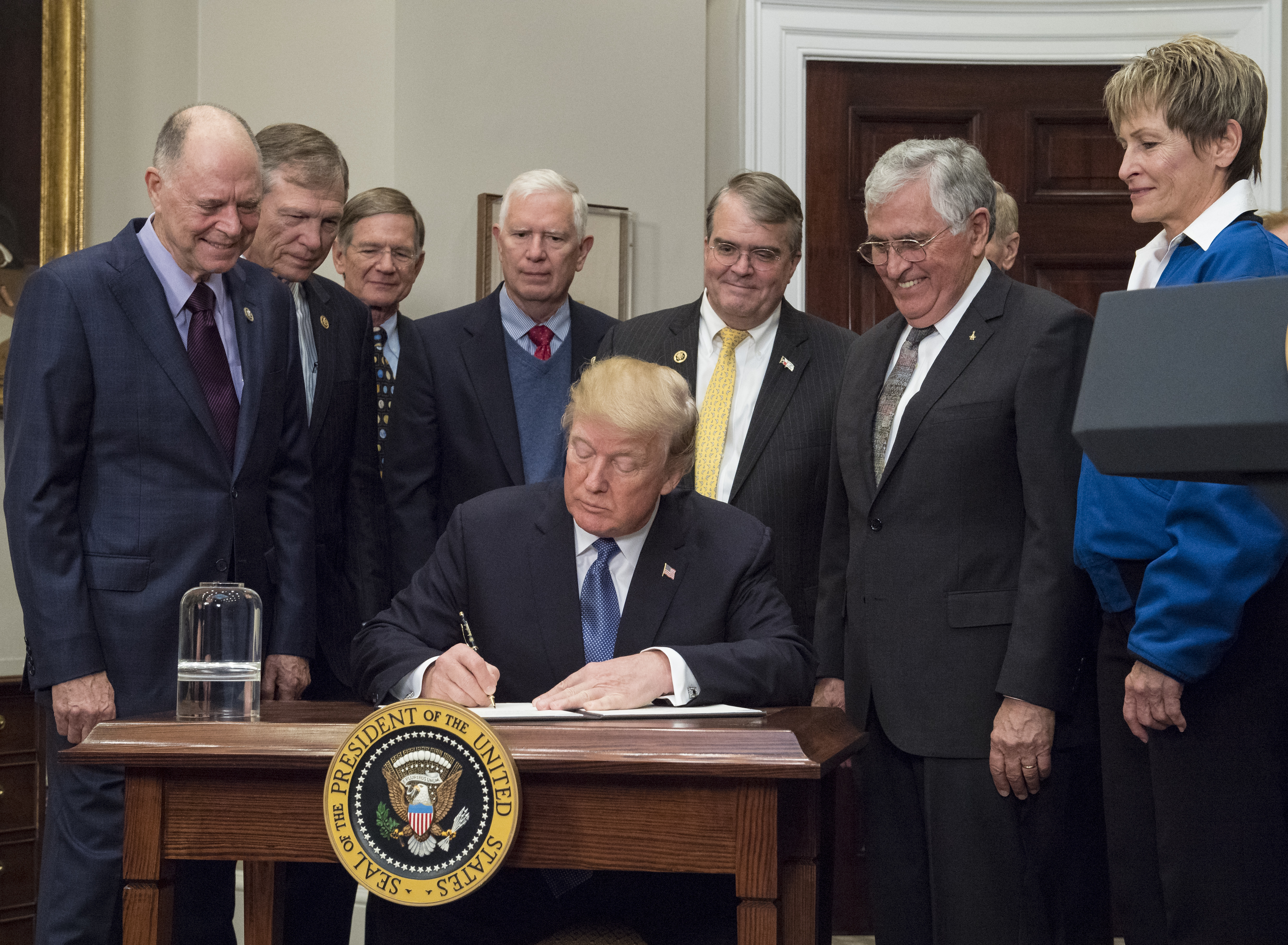 President Trump signs Space Policy Directive 1 surrounded almost entirely by men in 2017